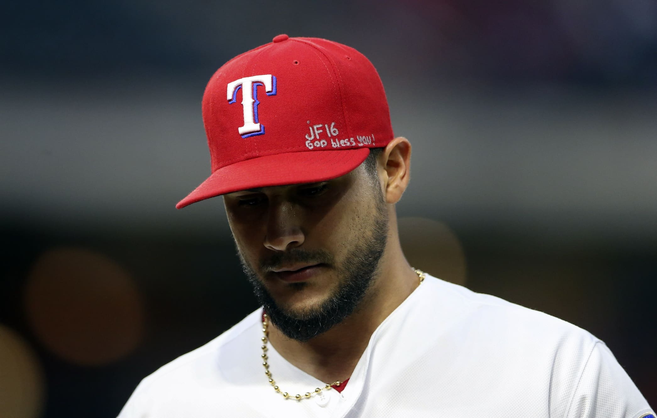 Sep 26, 2016; Arlington, TX, USA; Texas Rangers starting pitcher Martin Perez (33) wears a message on his hat for deceased Miami Marlins pitcher Jose Fernandez during the first inning against the Milwaukee Brewers at Globe Life Park in Arlington. Mandatory Credit: Kevin Jairaj-USA TODAY Sports