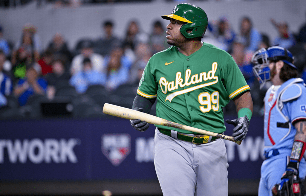 Apr 23, 2023; Arlington, Texas, USA; Oakland Athletics designated hitter Jesus Aguilar (99) reacts to striking out against the Texas Rangers during the game at Globe Life Field. Mandatory Credit: Jerome Miron-Imagn Images