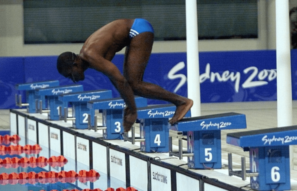 Eric Moussambani of Equatorial Guinea has the start blocks to himself as the other two entrants in the first heat of the 100 meter freestyle fouled out with false starts at the Sydney International Aquatic Center on Sept. 19, 2000. Xxx E02 Swim 20 Moussambani S Oly Swm Aus