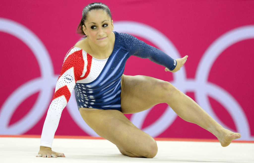 Aug 7, 2012; London, United Kingdom; Jordyn Wieber (USA) rolls on the ground after competing in the women's floor exercise final during the 2012 London Olympic Games at North Greenwich Arena. Mandatory Credit: Jerry Lai-Imagn Images
