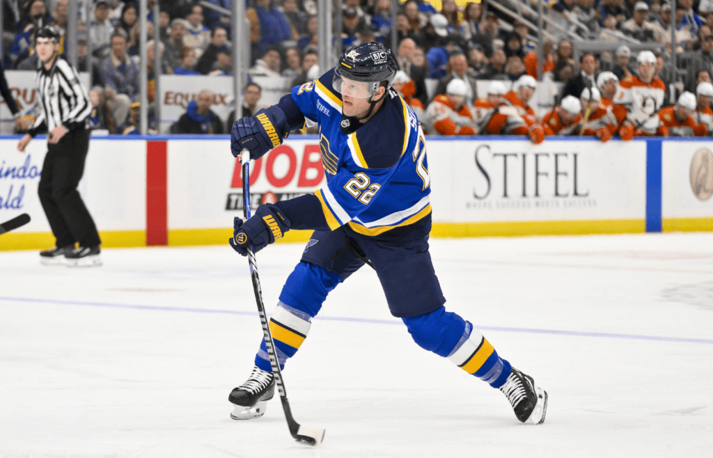 Mar 16, 2025; St. Louis, Missouri, USA; St. Louis Blues defenseman Ryan Suter (22) shoots against the Anaheim Ducks during the second period at Enterprise Center. Mandatory Credit: Jeff Curry-Imagn Images