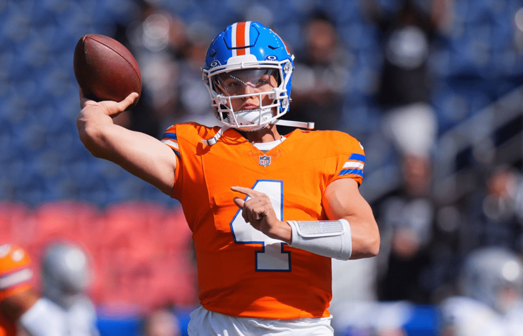 Oct 6, 2024; Denver, Colorado, USA; Denver Broncos quarterback Zach Wilson (4) warms up before the game against the Las Vegas Raiders at Empower Field at Mile High. Mandatory Credit: Ron Chenoy-Imagn Images