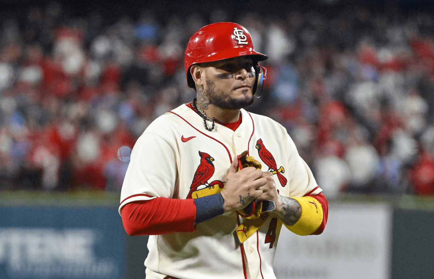 St. Louis Cardinals catcher Yadier Molina (4) walks off the field after hitting a single for his final postseason at bat in the ninth inning against the Philadelphia Phillies during game two of the Wild Card series for the 2022 MLB Playoffs at Busch Stadium.