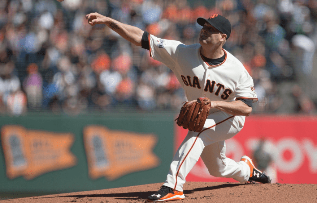 Oct 1, 2015; San Francisco, CA, USA; San Francisco Giants starting pitcher Tim Hudson (17) pitches against the Los Angeles Dodgers during the first inning at AT&T Park. Mandatory Credit: Kelley L Cox-Imagn Images