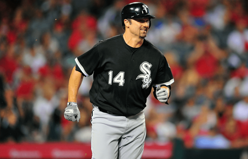 August 23, 2011; Anaheim, CA, USA; Chicago White Sox first baseman Paul Konerko (14) runs to first after he hits an RBI single in the eighth inning against the Los Angeles Angels at Angel Stadium. The hit was Konerko's 2000th of his career. Mandatory Credit: Gary A. Vasquez-Imagn Images