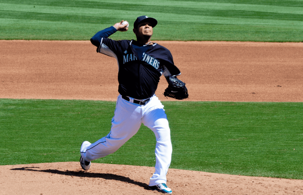 Mar 26, 2015; Peoria, AZ, USA; Seattle Mariners starting pitcher Felix Hernandez (34) throws the ball during the fifth inning against the Kansas City Royals at Peoria Sports Complex. Mandatory Credit: Matt Kartozian-Imagn Images