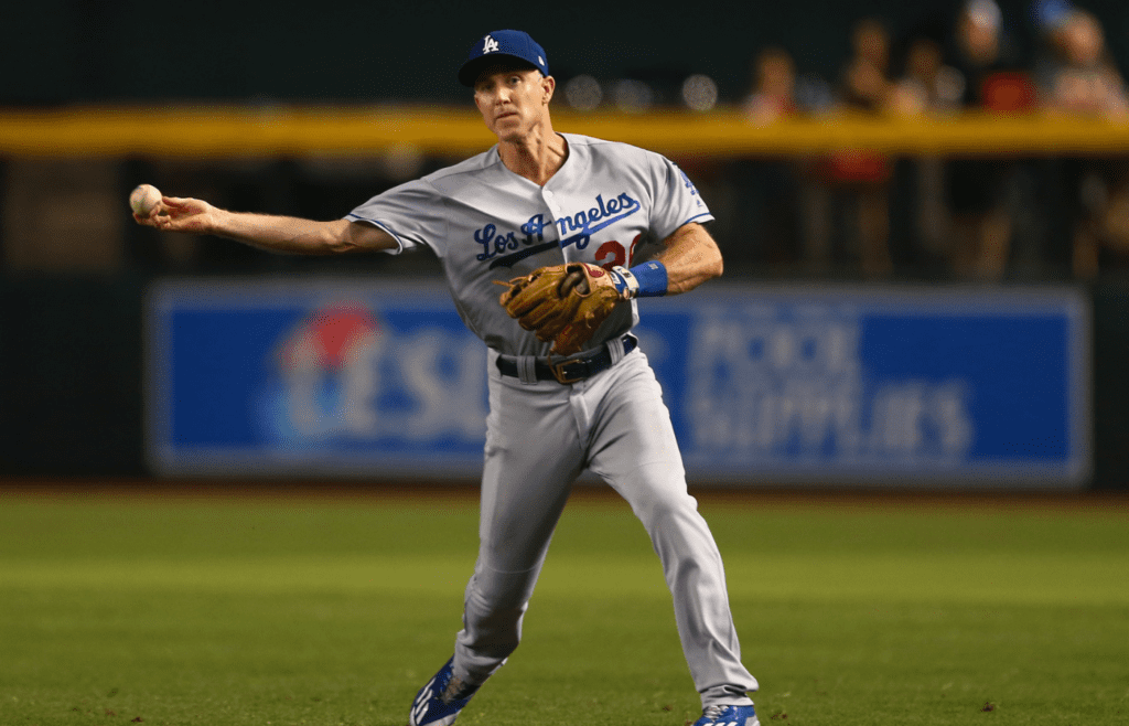 Aug 9, 2017; Phoenix, AZ, USA; Los Angeles Dodgers second baseman Chase Utley throws to first for an out in the first inning against the Arizona Diamondbacks at Chase Field. Mandatory Credit: Mark J. Rebilas-Imagn Images