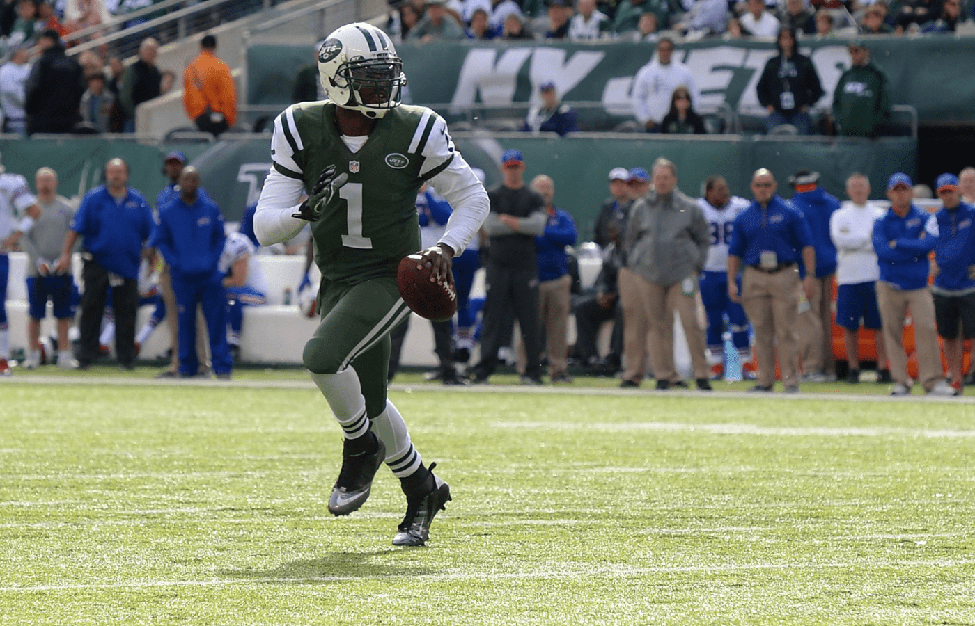 Oct 26, 2014; East Rutherford, NJ, USA; New York Jets quarterback Michael Vick (1) scrambles during the second quarter against the Buffalo Bills at MetLife Stadium. Buffalo Bills defeated New York Jets 43-23. Mandatory Credit: Tommy Gilligan-Imagn Images