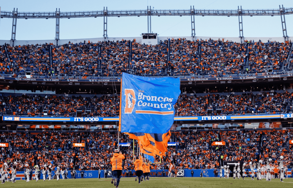 Jan 5, 2025; Denver, Colorado, USA; Flags are run down the field after a Denver Broncos touchdown in the third quarter against the Kansas City Chiefs at Empower Field at Mile High. Mandatory Credit: Isaiah J. Downing-Imagn Images