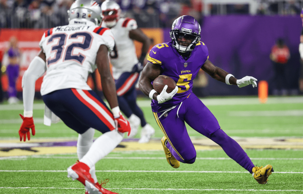 Nov 24, 2022; Minneapolis, Minnesota, USA; Minnesota Vikings wide receiver Jalen Reagor (5) runs with the ball against the New England Patriots during the third quarter at U.S. Bank Stadium. Mandatory Credit: Matt Krohn-Imagn Images