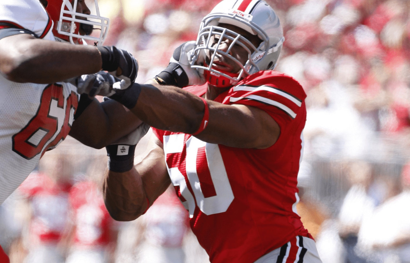 Sep 1, 2007; Columbus, OH, USA; Ohio State Buckeyes linebacker Gholston Vernon against Youngstown State Penguins offensive tackle Theodore Nhemie (66) at Ohio Stadium. The Buckeyes beat the Penguins 38-6. Mandatory Credit: Photo By Matthew Emmons- Imagn Images