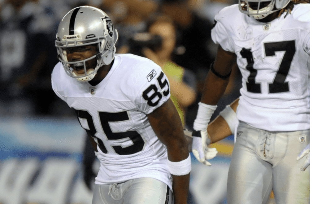 Nov 10, 2011; San Diego, CA, USA; Oakland Raiders receiver Denarius Moore (17), center, celebrates with receiver Darius Heyward-Bey (85), left, and guard Stefen Wisniewski (61) after scoring on a 33-yard touchdown reception in the second quarter against the San Diego Chargers at Qualcomm Stadium. Mandatory Credit: Kirby Lee/Image of Sport-Imagn Images