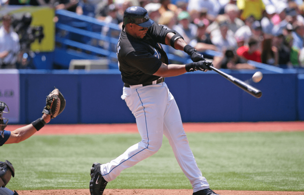 Jun 24, 2007; Toronto, ON, Canada; Toronto Blue Jays designated hitter (35) Frank Thomas hits a home run in the 4th inning, his 499th career home run, against the Colorado Rockies at the Rogers Centre in Toronto, ON. Toronto won 5-0. Mandatory Credit: Tom Szczerbowski-Imagn Images