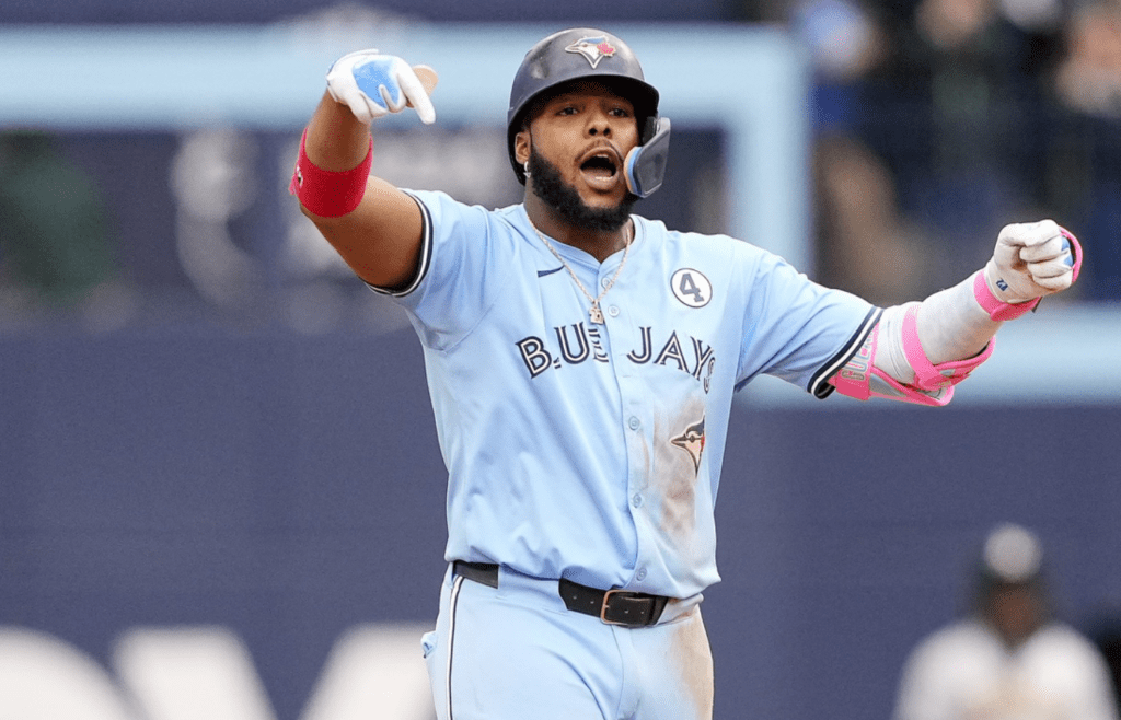 Jun 1, 2025; Toronto, Ontario, CAN; Toronto Blue Jays designated hitter Vladimir Guerrero (27) celebrates his two run double against the Athletics during the eighth inning at Rogers Centre. Mandatory Credit: John E. Sokolowski-Imagn Images