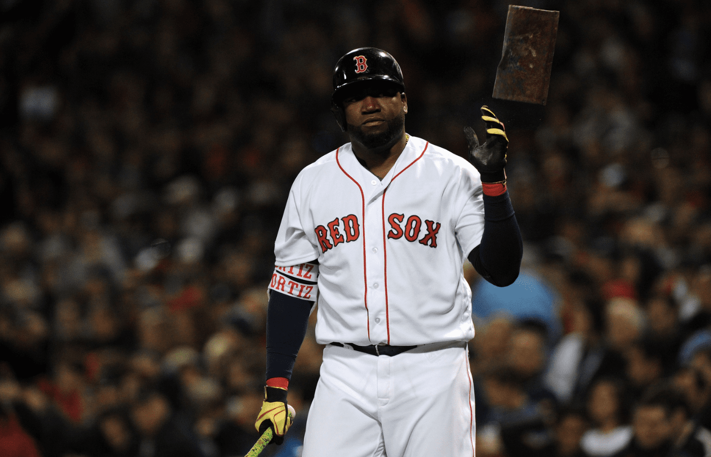 Boston Red Sox designated hitter David Ortiz (34) tosses the pine tar rag before hitting in the fourth inning against the Cleveland Indians during game three of the 2016 ALDS playoff baseball series at Fenway Park.