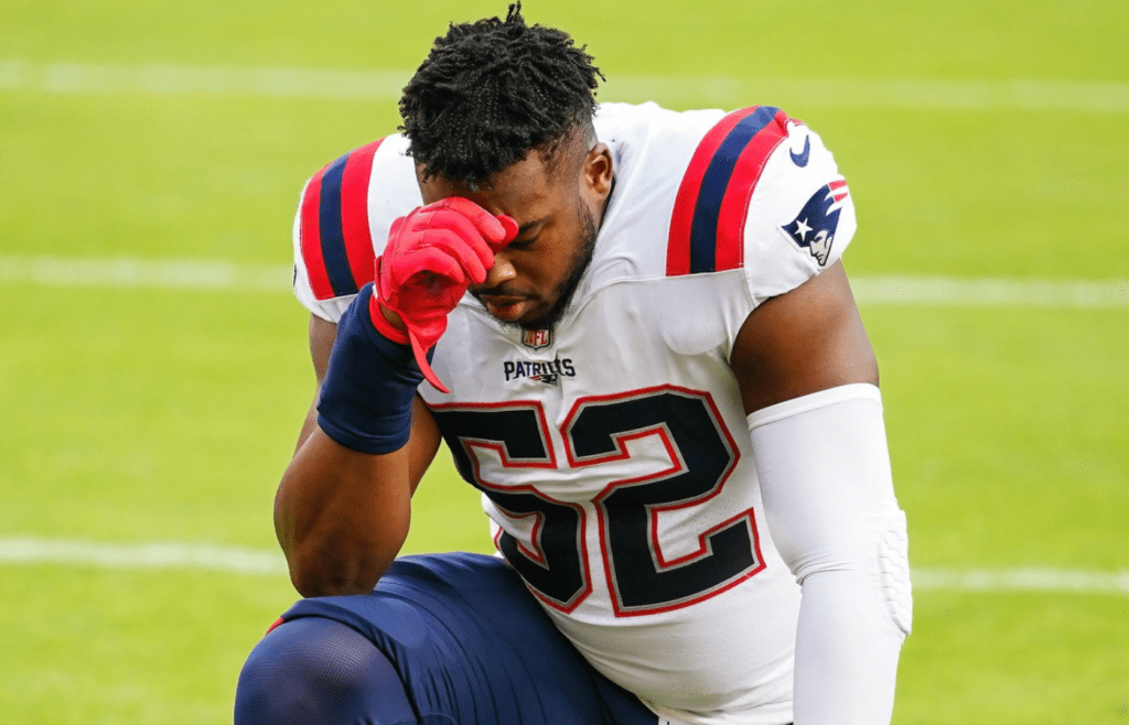 Oct 5, 2020; Kansas City, Missouri, USA; New England Patriots outside linebacker Brandon Copeland (52) prays before the game against the Kansas City Chiefs at Arrowhead Stadium. Mandatory Credit: Jay Biggerstaff-Imagn Images