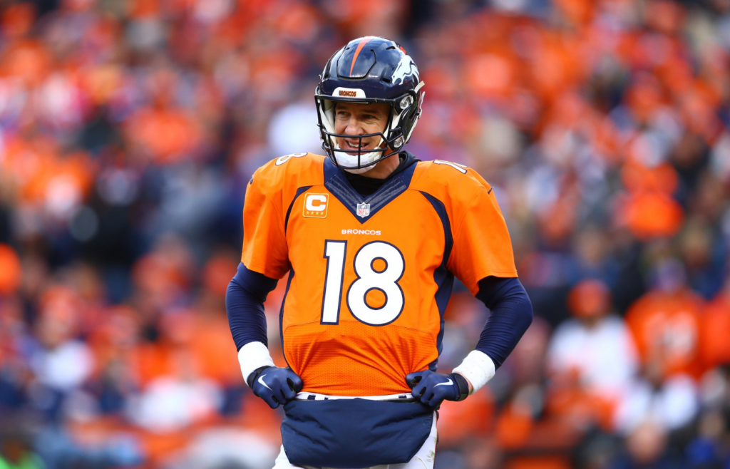 Jan 24, 2016; Denver, CO, USA; Denver Broncos quarterback Peyton Manning (18) against the New England Patriots in the AFC Championship football game at Sports Authority Field at Mile High. The Broncos defeated the Patriots 20-18 to advance to the Super Bowl. Mandatory Credit: Mark J. Rebilas-Imagn Images