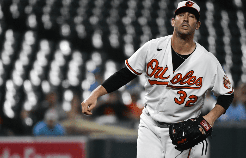Sep 8, 2021; Baltimore, Maryland, USA; Baltimore Orioles starting pitcher Matt Harvey (32) reacts after giving up a third inning hit against the Kansas City Royals\ at Oriole Park at Camden Yards. Mandatory Credit: Tommy Gilligan-Imagn Images