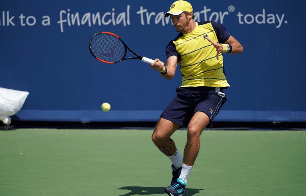 Aug 12, 2018; Mason, OH, USA; Dusan Lajovic (SRB) returns a shot against Marcos Baghdatis (CYP) in the Western and Southern tennis open at Lindner Family Tennis Center. Mandatory Credit: Aaron Doster-Imagn Images