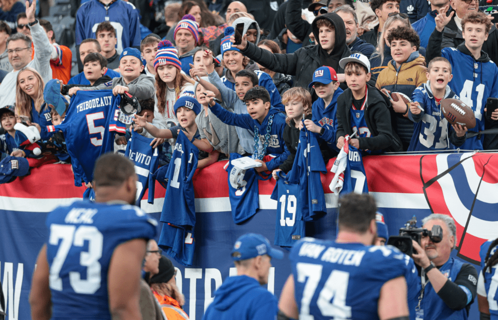 Dec 29, 2024; East Rutherford, New Jersey, USA; Fans cheer after the game between the New York Giants and the Indianapolis Colts at MetLife Stadium. Mandatory Credit: Vincent Carchietta-Imagn Images