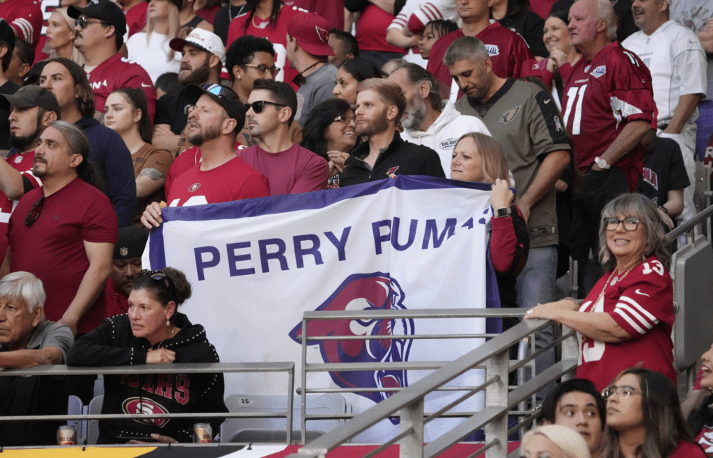 San Francisco 49ers fans hold a Perry High banner for San Francisco 49ers quarterback Brock Purdy (13) during the second quarter against the Arizona Cardinals at State Farm Stadium in Glendale on Dec. 17, 2023. Purdy went to school at Perry High