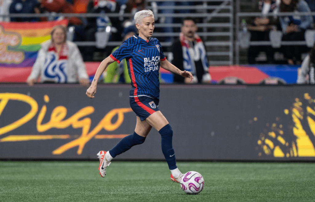 Oct 20, 2023; Seattle, Washington, USA; OL Reign forward Megan Rapinoe (15) dribbles the ball against Angel City FC at Lumen Field. Mandatory Credit: Stephen Brashear-Imagn Images