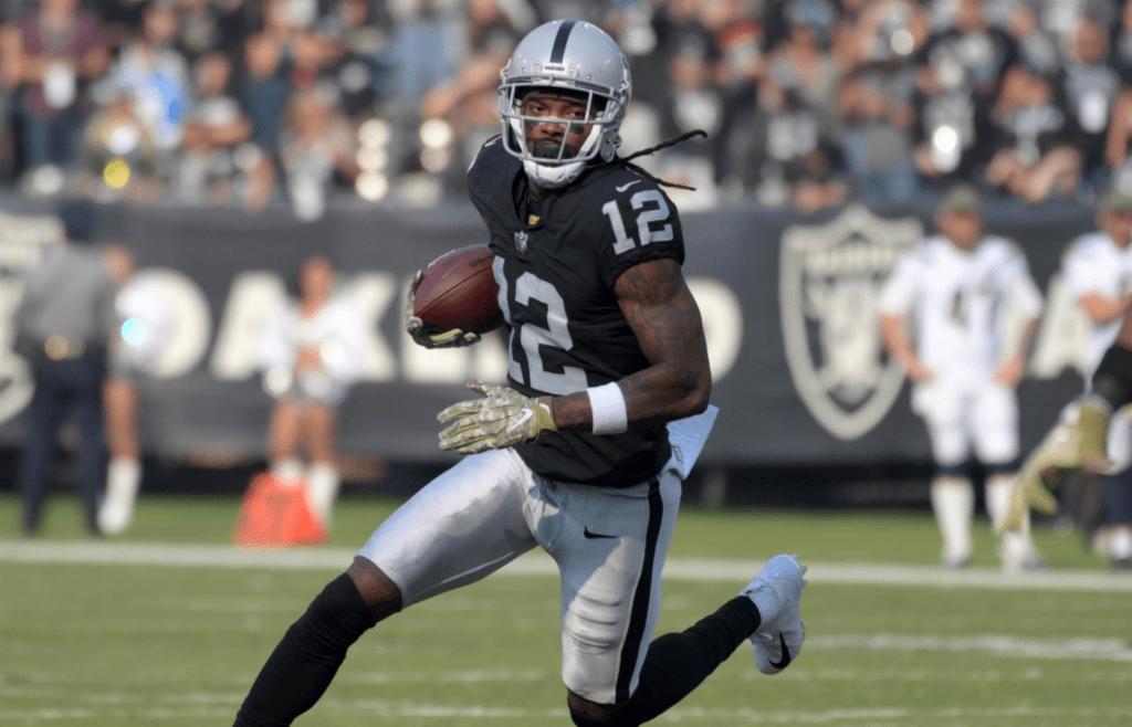 Nov 11, 2018; Oakland, CA, USA; Oakland Raiders wide receiver Martavis Bryant (12) carries the ball against the Los Angeles Chargers in the first quarter at Oakland-Alameda County Coliseum. Mandatory Credit: Kirby Lee-Imagn Images
