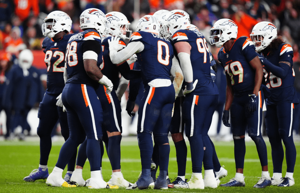 Dec 2, 2024; Denver, Colorado, USA; Members of the Denver Broncos defensive team huddle in the second half against the Cleveland Browns at Empower Field at Mile High. Mandatory Credit: Ron Chenoy-Imagn Images