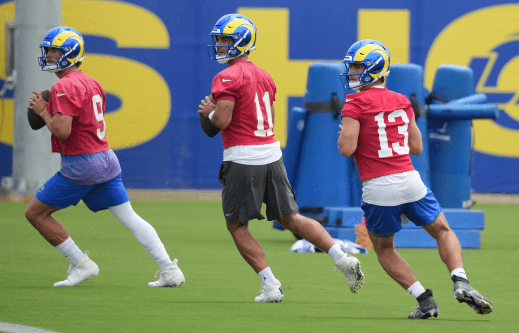 May 28, 2025; Woodland Hills, CA, USA; Los Angeles Rams quarterbacks Stetson Bennett (13) Jimmy Garoppolo (11) and Matt Stafford (9) participate in offensive drills during organized team activities at Rams Practice Facility. Mandatory Credit: Kirby Lee-Imagn Images