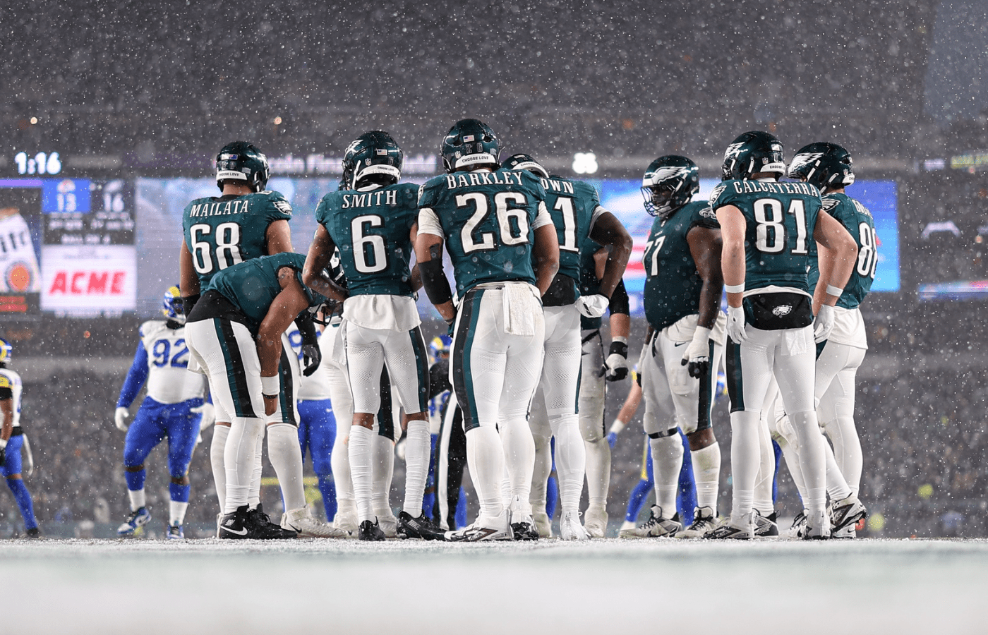 Jan 19, 2025; Philadelphia, Pennsylvania, USA; Philadelphia Eagles running back Saquon Barkley (26) and his team huddle up for a play against the Los Angeles Rams in a 2025 NFC divisional round game at Lincoln Financial Field. Mandatory Credit: Bill Streicher-Imagn Images