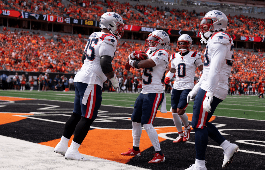 Sep 8, 2024; Cincinnati, Ohio, USA; New England Patriots corner back Marcus Jones (25) celebrates with his team in the second quarter of the NFL game against the New England Patriots at Paycor Stadium. Mandatory Credit: Albert Cesare/USA TODAY Network via Imagn Images