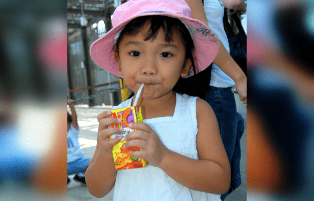 Little girl drinking Hi-C Juice