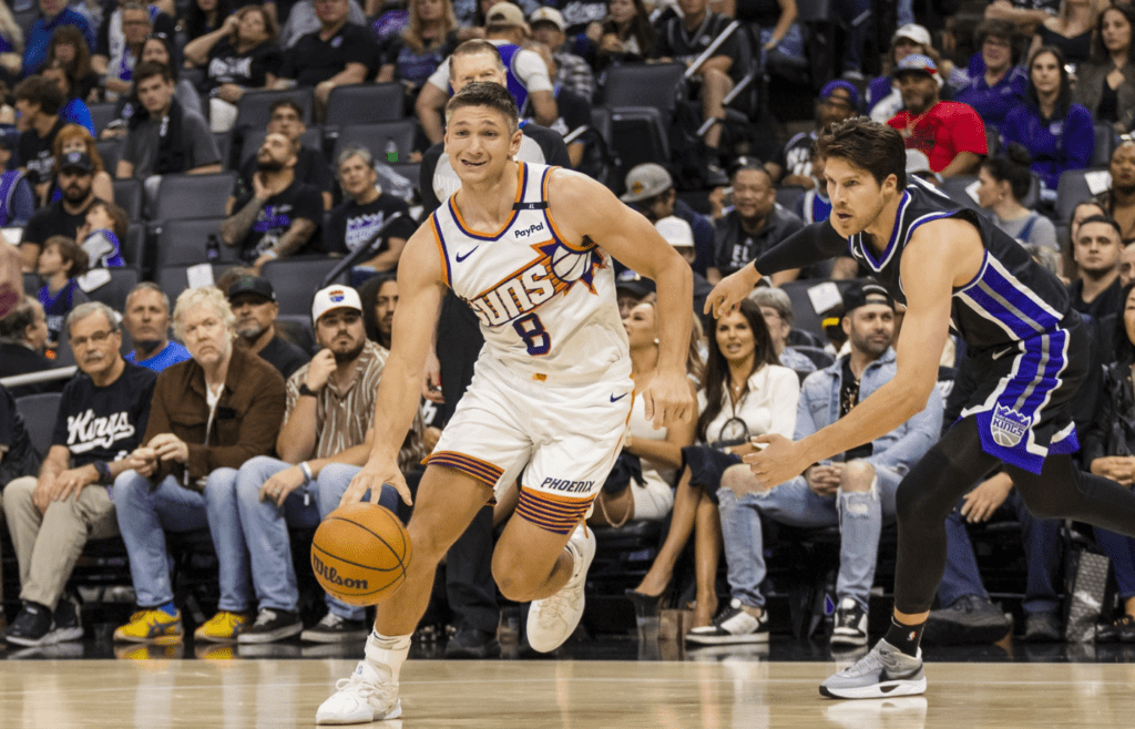 Apr 13, 2025; Sacramento, California, USA; Phoenix Suns guard Grayson Allen (8) dribbles against the Sacramento Kings during the fourth quarter at Golden 1 Center. Mandatory Credit: John Hefti-Imagn Images