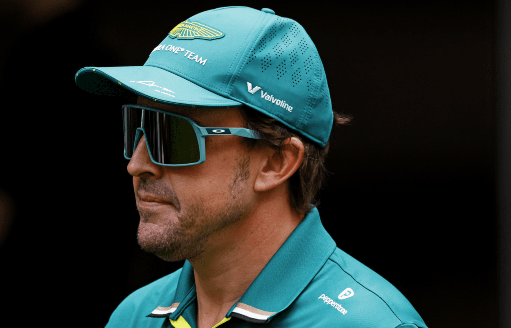 May 1, 2025; Miami Gardens, FL, USA; Aston Martin driver Fernando Alonso (14) walks in the paddock ahead of the F1 Miami Grand Prix at Miami International Autodrome. Mandatory Credit: Peter Casey-Imagn Images
