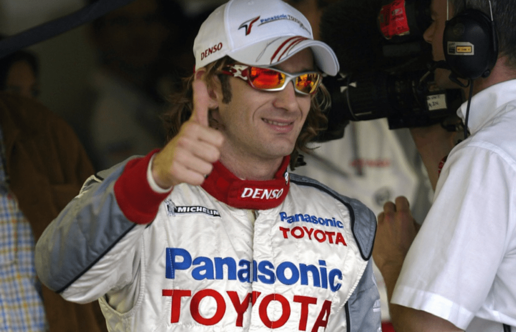 June 18, 2005; Indianapolis, IN, USA; Jarno Trulli #16 of Panasonic Toyota Racing gives a thumbs up after winning the pole position for the United States Grand Prix at the Indianapolis Motor Speedway. Mandatory Credit: Photo By Jeff Hanisch-Imagn Images Copyright (c) 2005 Jeff Hanisch