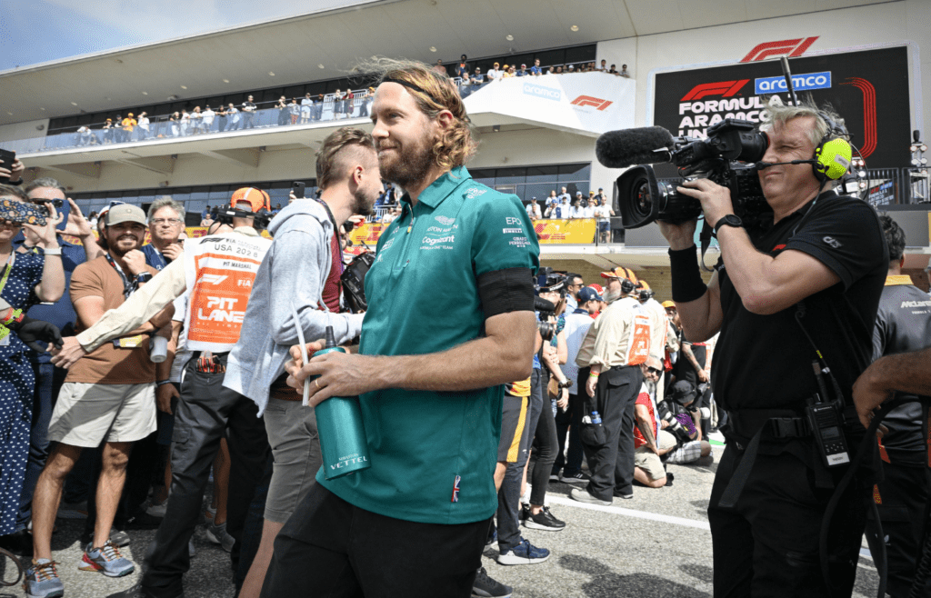 Oct 23, 2022; Austin, Texas, USA; Aston Martin Aramco Cognizant Formula One Team driver Sebastian Vettel (5) of Team Germany walks on to the track before the running of the U.S. Grand Prix F1 race at Circuit of the Americas. Mandatory Credit: Jerome Miron-Imagn Images