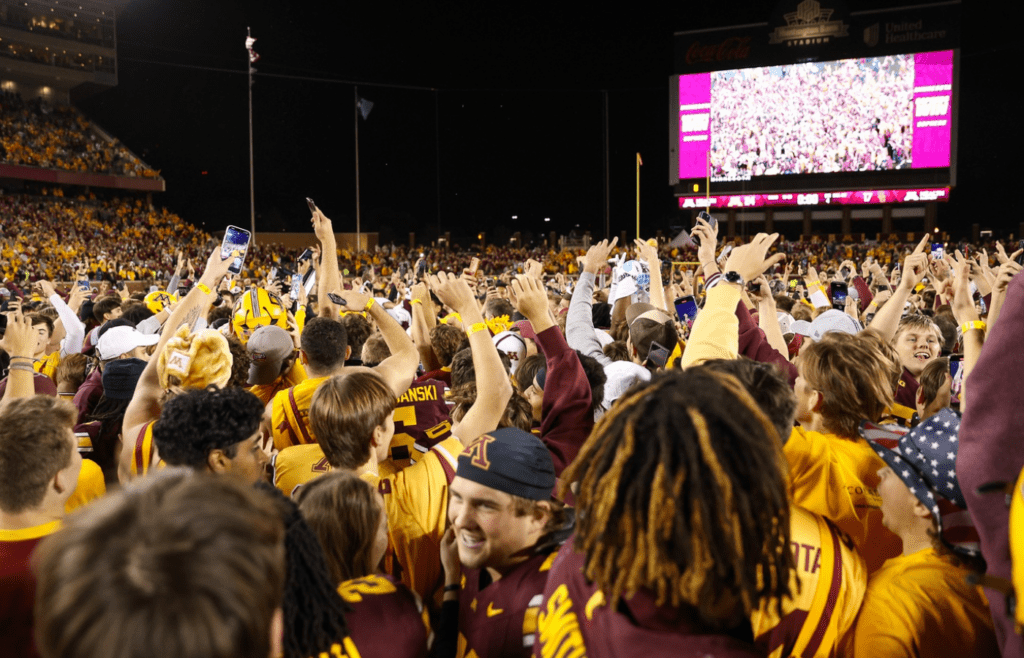Oct 5, 2024; Minneapolis, Minnesota, USA; Minnesota Golden Gophers fans celebrate on the field after the game against the USC Trojans at Huntington Bank Stadium. Mandatory Credit: Matt Krohn-Imagn Images