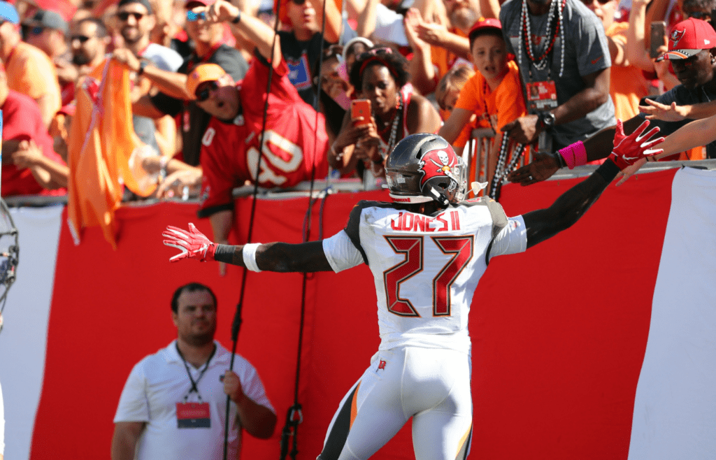 Nov 10, 2019; Tampa, FL, USA; Tampa Bay Buccaneers running back Ronald Jones (27) celebrates with fans after scoring a touchdown against the Arizona Cardinals during the first quarter at Raymond James Stadium. Mandatory Credit: Kim Klement-Imagn Images