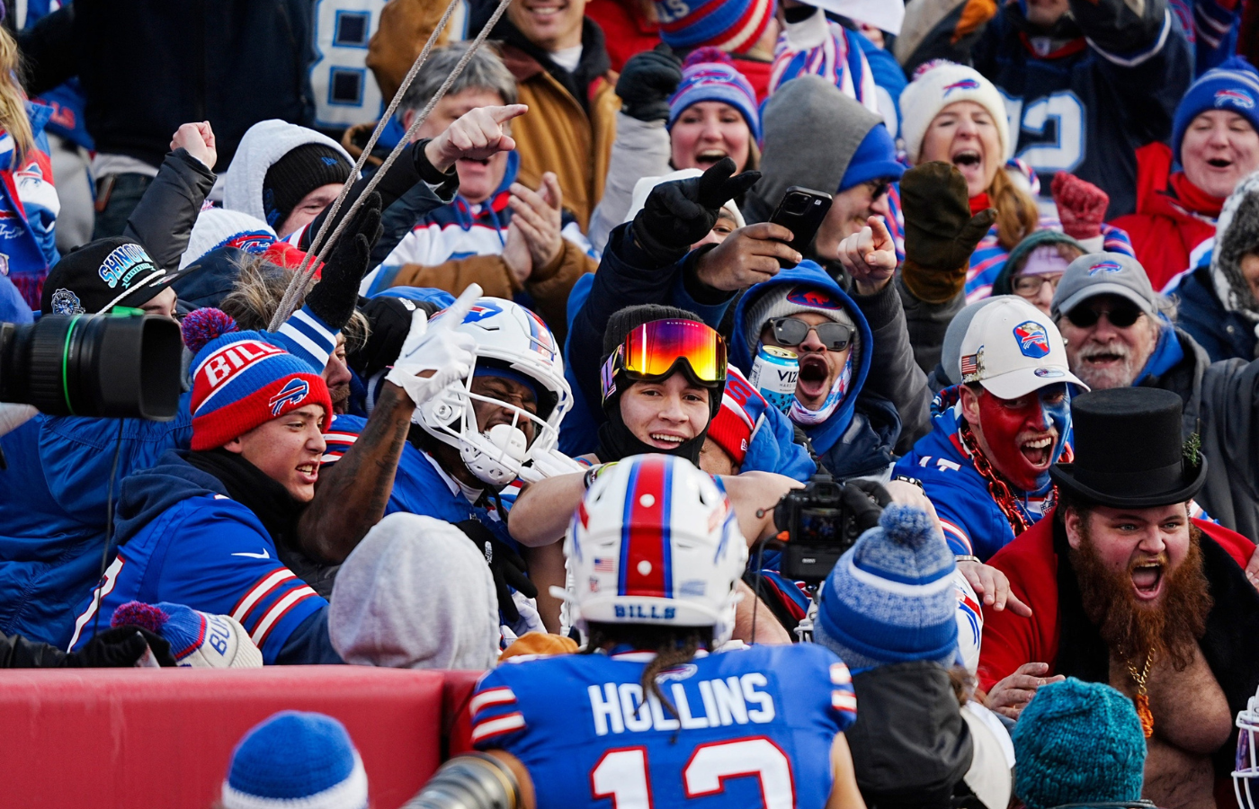 Buffalo Bills wide receiver Curtis Samuel (1) jumps into the fan section to celebrate his touchdown with the fans during the second half of the Buffalo Bills wild card game against the Denver Broncos at Highmark Stadium in Orchard Park on Jan. 12, 2025.