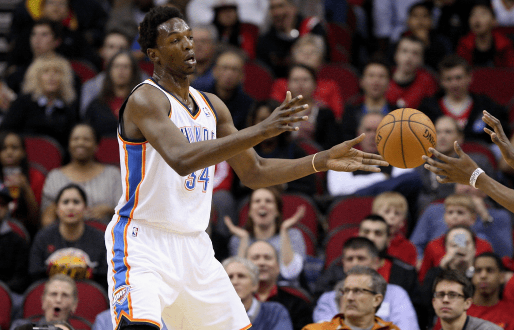 Feb 20, 2013; Houston, TX, USA; Oklahoma City Thunder center Hasheem Thabeet (34) passes the ball during the fourth quarter against the Houston Rockets at Toyota Center. The Rockets defeated the Thunder 122-119. Mandatory Credit: Troy Taormina-Imagn Images
