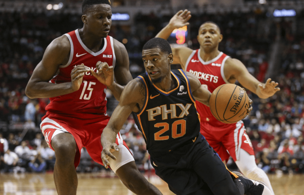 Apr 7, 2019; Houston, TX, USA; Phoenix Suns forward Josh Jackson (20) dribbles the ball against Houston Rockets center Clint Capela (15) during the third quarter at Toyota Center. Mandatory Credit: Troy Taormina-Imagn Images