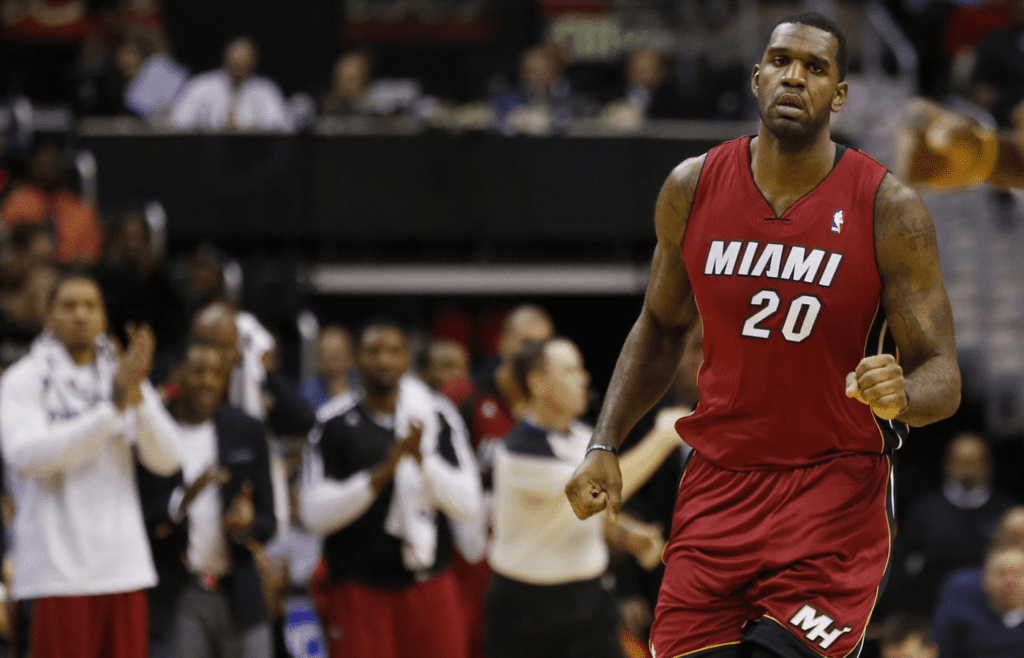 Jan 15, 2014; Washington, DC, USA; Miami Heat center Greg Oden (20) runs down the court after scoring against the Washington Wizards Girls in the second quarter at Verizon Center. The Wizards won 114-97. Mandatory Credit: Geoff Burke-Imagn Images