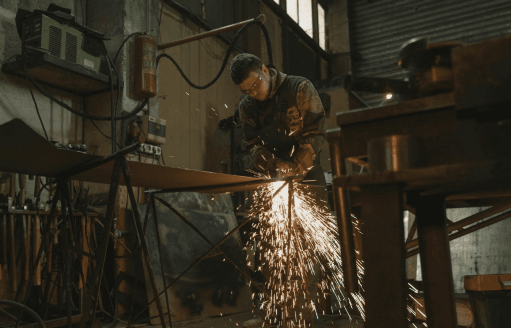 A welder working on a metal structure