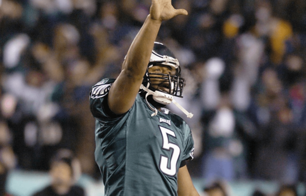 Eagles quarterback Donovan McNabb celebrates his fourth-quarter touchdown pass to Chad Lewis in his team's 27-10 win over Atlanta in the NFC Championship game at Lincoln Financial Field in Philadelphia, Sunday, Jan. 23, 2005.