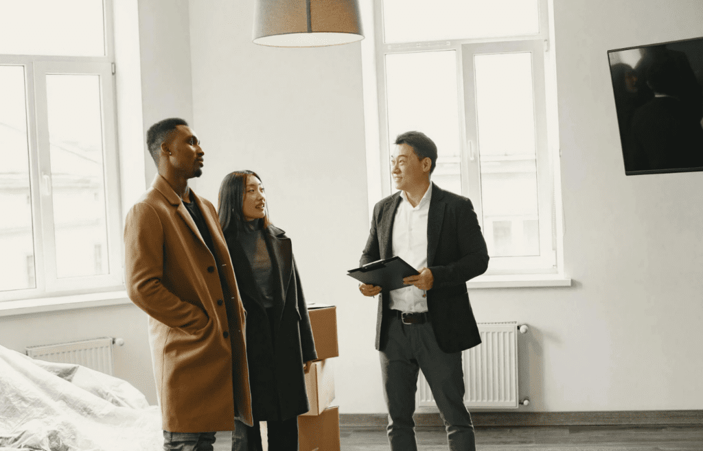 A real estate agent showing a house to clients