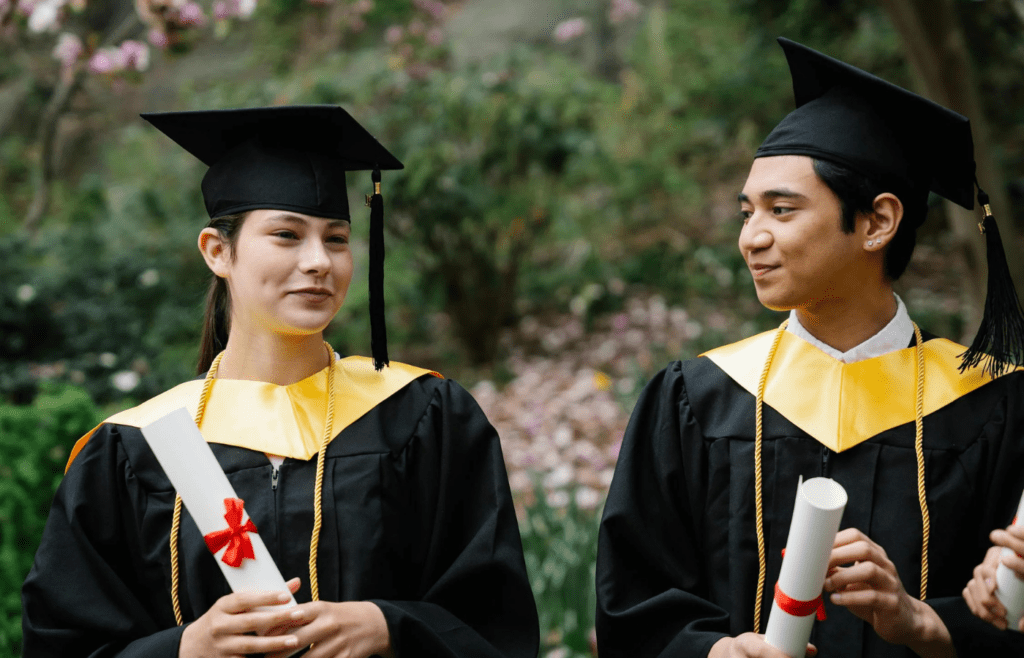 Graduation cap next to large loan paperwork
