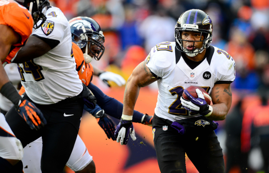 Jan 12, 2013; Denver, CO, USA; Baltimore Ravens running back Ray Rice (27) runs the ball in the first half against the Denver Broncos during the AFC divisional round playoff game at Sports Authority Field. Mandatory Credit: Mark J. Rebilas-Imagn Images