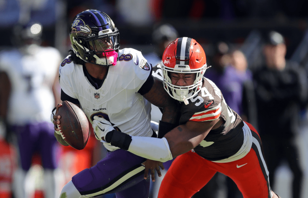 Cleveland Browns defensive end Ogbo Okoronkwo (54) sacks Baltimore Ravens quarterback Lamar Jackson (8) on Oct. 27, 2024, in Cleveland, Ohio.