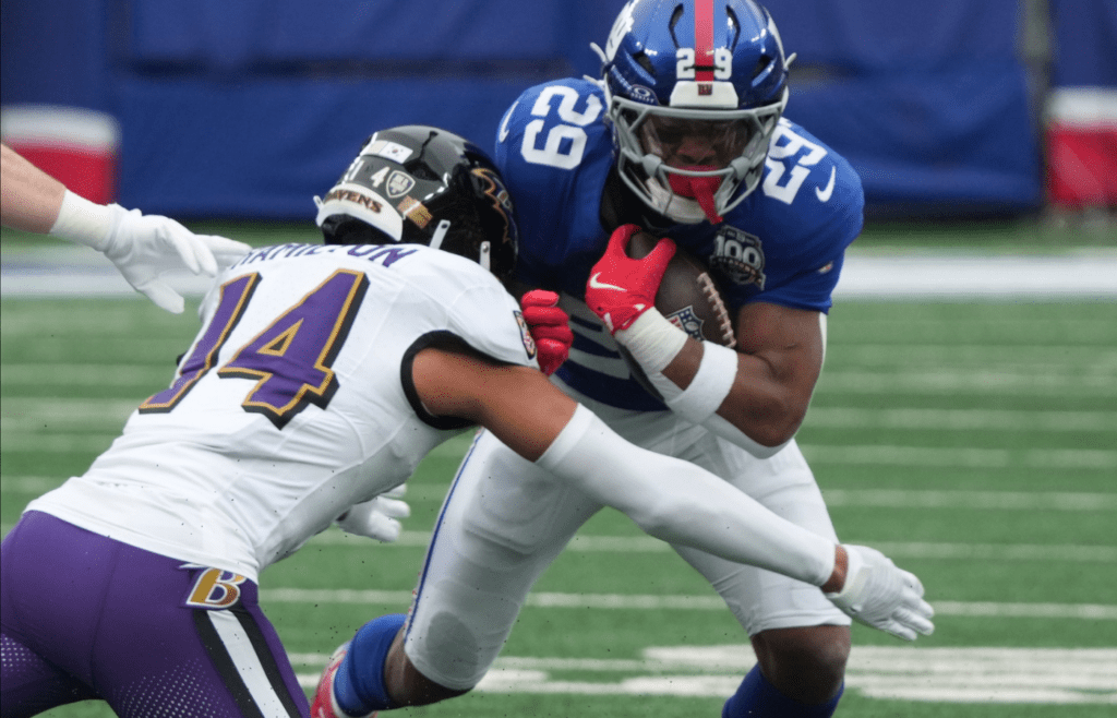 East Rutherford, NJ -- December 15, 2024 -- Kyle Hamilton of the Ravens and Tyrone Tracy Jr. of the Giants in the first half. The Baltimore Ravens came to MetLife Stadium to play the New York Giants.