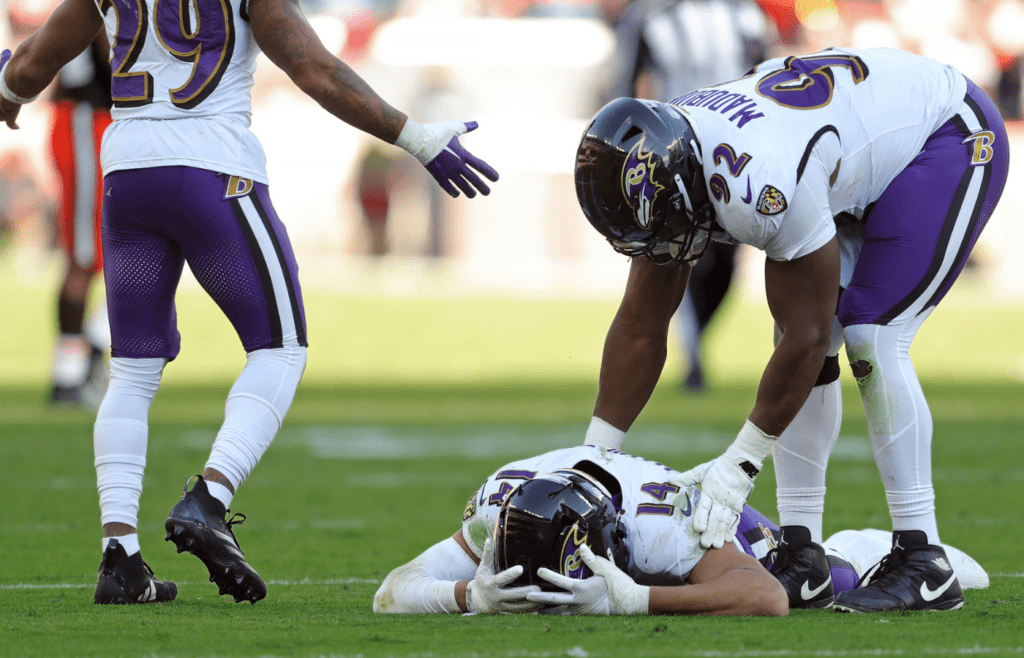 Baltimore Ravens safety Kyle Hamilton (14) is comforted by defensive tackle Nnamdi Madubuike (92) after dropping what would have been the game-winning interception during the second half of an NFL football game against the Cleveland Browns at Huntington Bank Field, Sunday, Oct. 27, 2024, in Cleveland, Ohio.